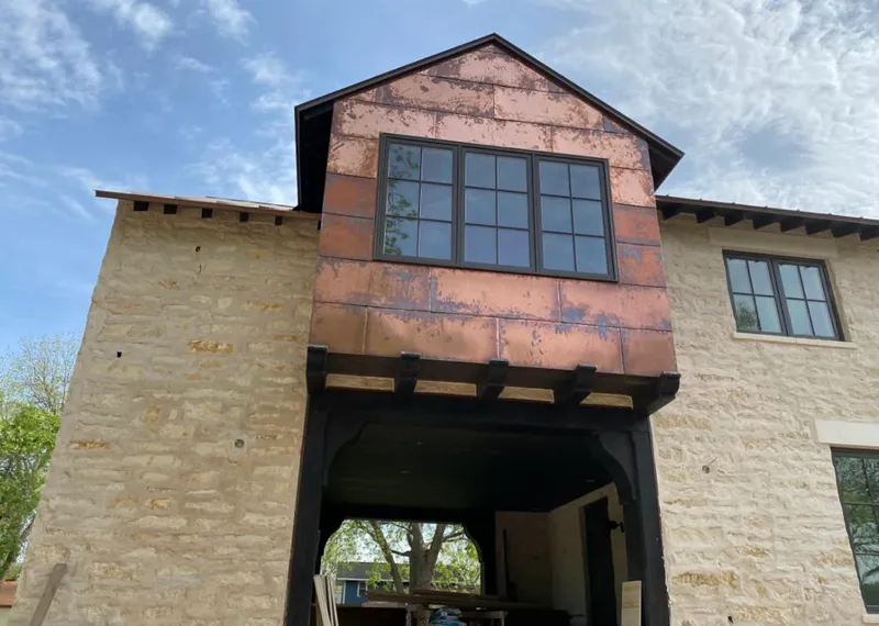 Copper metal panel facade on a stone building for Skylight Installation in Dawsonville